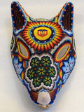 Cabeza de coyote con cuentas huichol